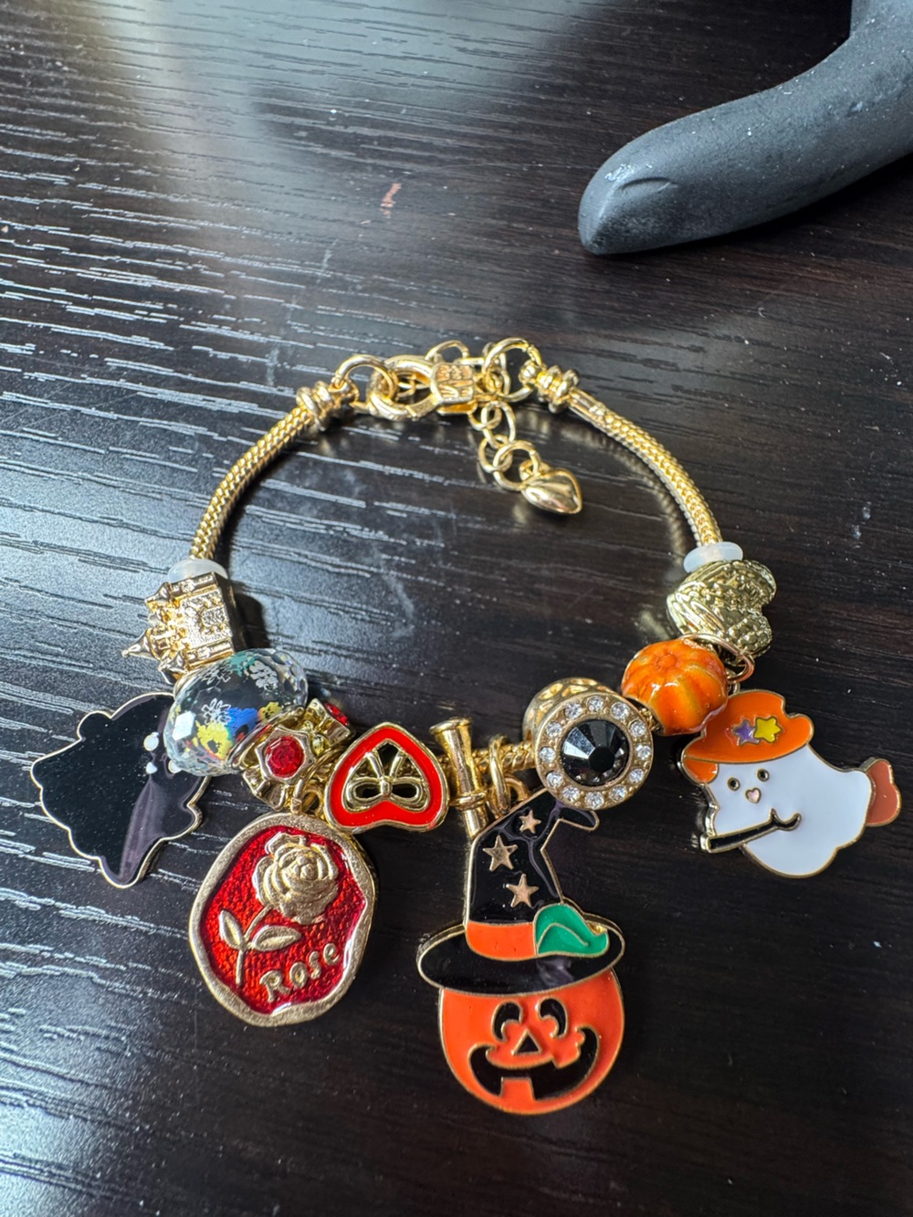 Women’s Gold-Tone Charm Bracelet with Orange and Red Accents